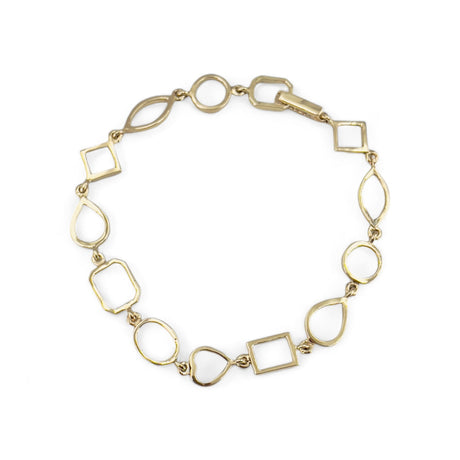 top view of Gold bracelet with empty mixed bezel links; heart, round, pear, square, marquise and emerald cut on a white background